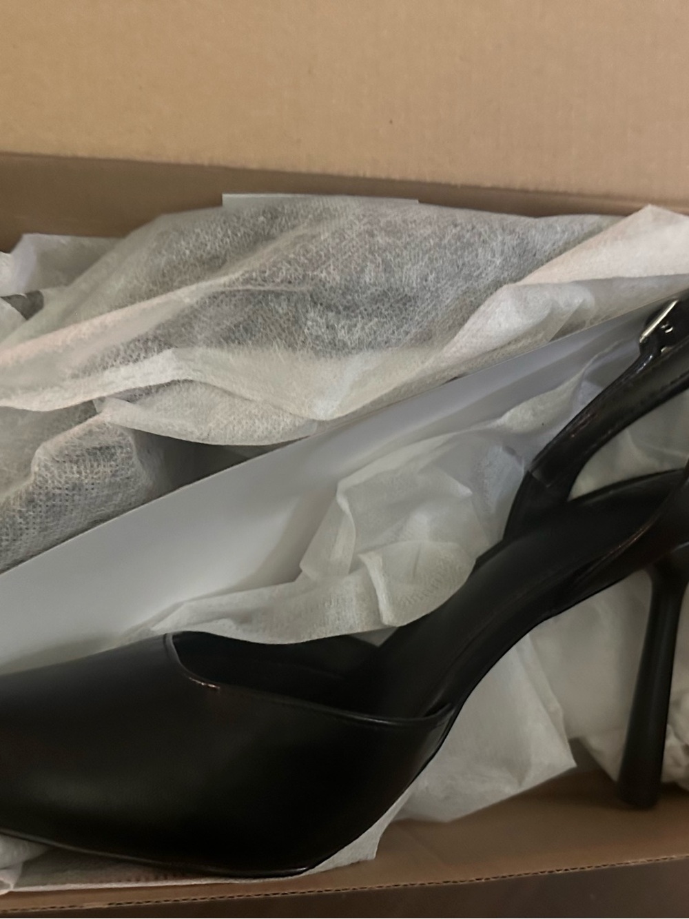 Black pointed toe pumps